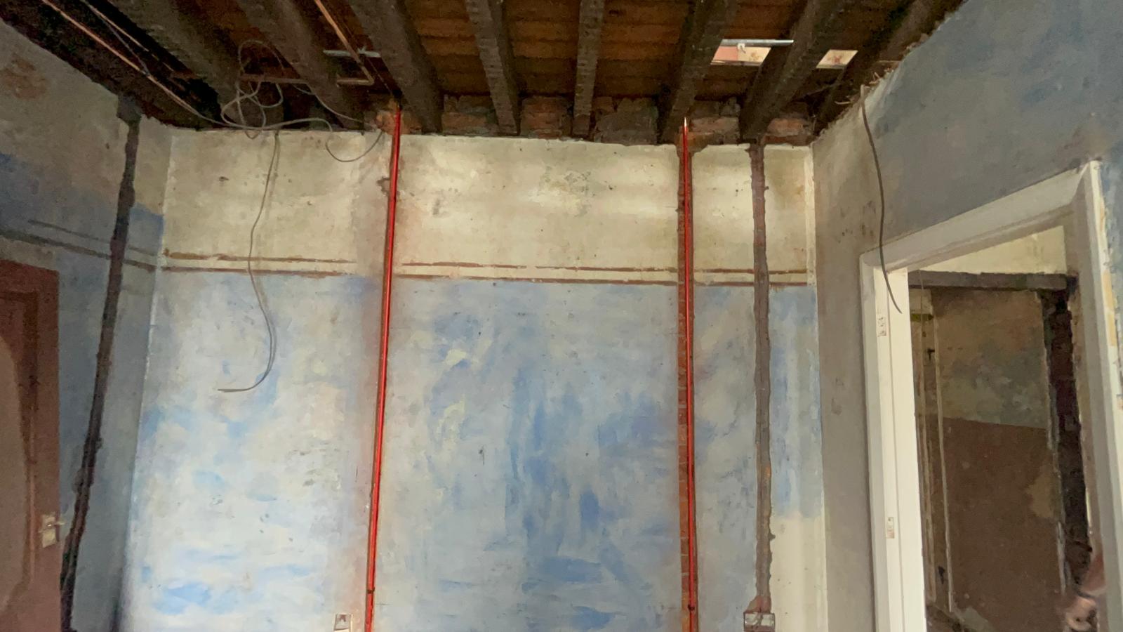 Copper heating pipes chased into a corner wall during a whole house pipework first fix