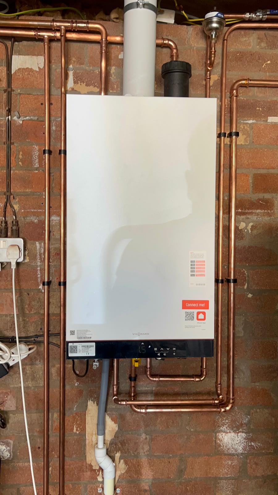 Viessmann combi boiler installed with magnetic filter, flue and neat copper pipework