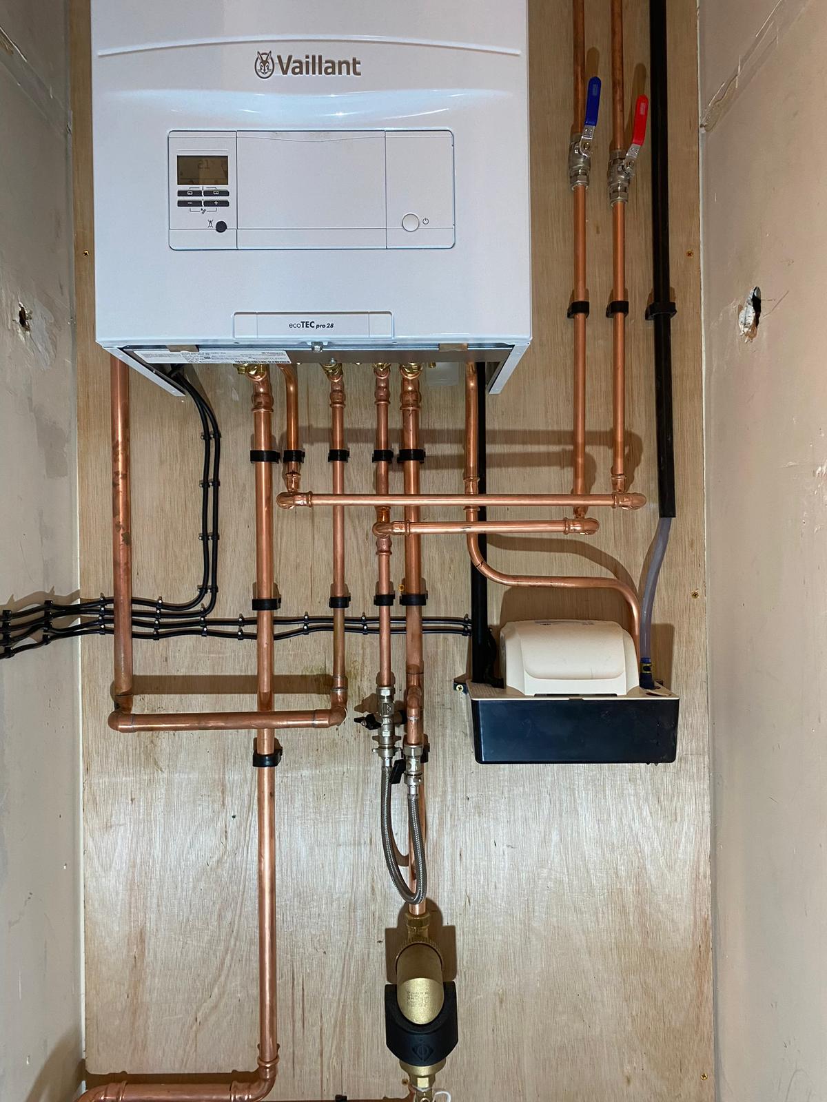 Vaillant ecoTEC pro boiler during diagnostic repair by Conroy Plumbing engineer