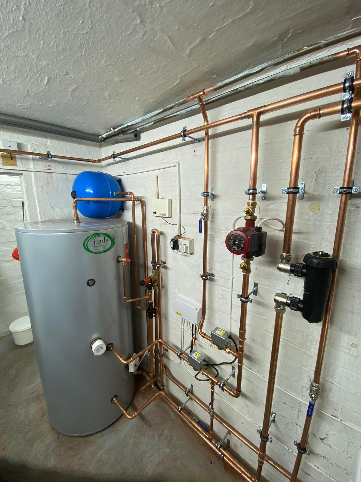 Joule unvented cylinder installation with pump expansion vessel and copper pipework