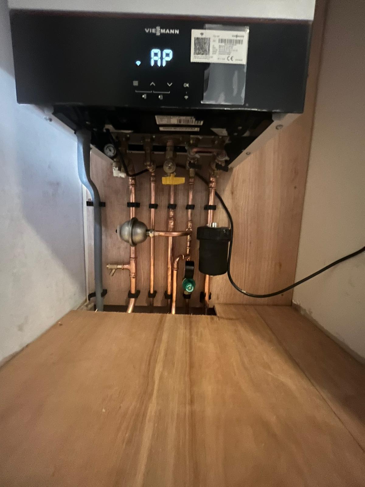 Viessmann boiler showing copper pipework and magnetic system filter